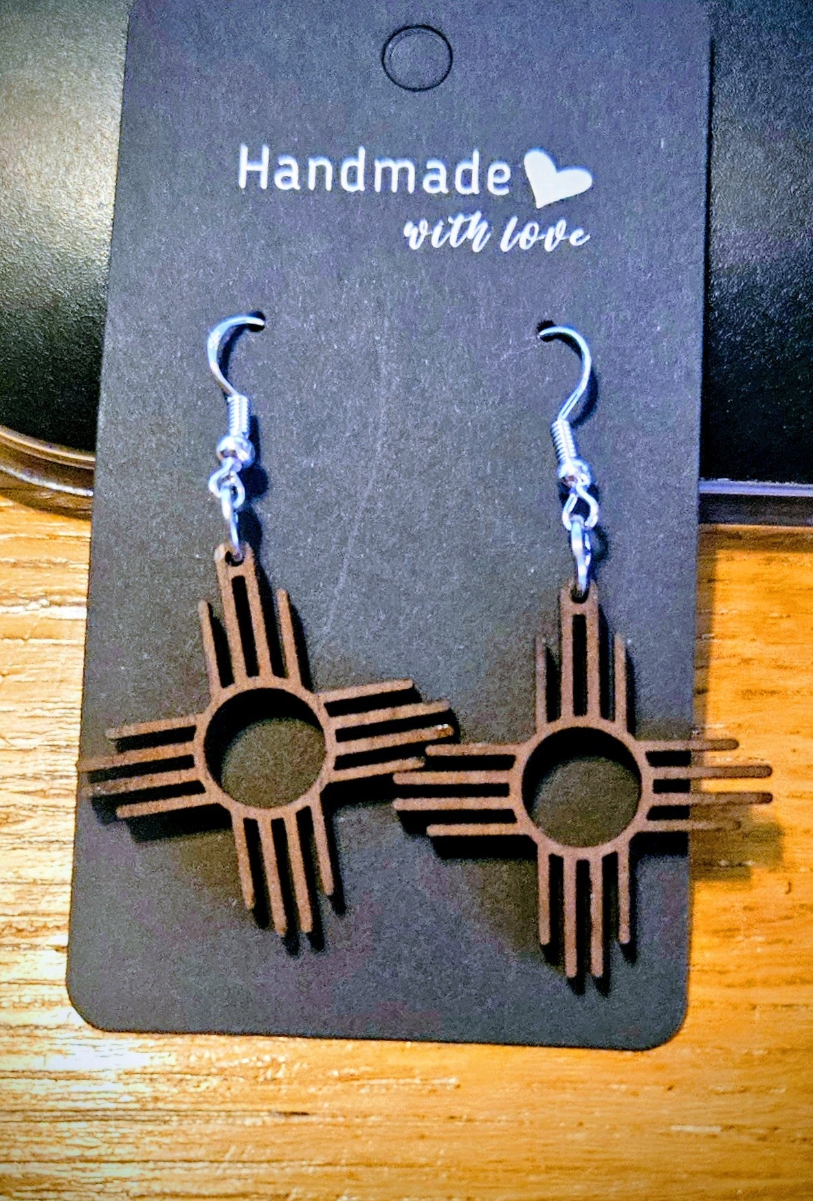 Zia Earrings Dangle with round center.